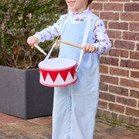 Little English classic children's clothing. White knit turtleneck with holiday train print layered under light blue corduroy Campbell Overall. Holiday outfit for toddler boys.