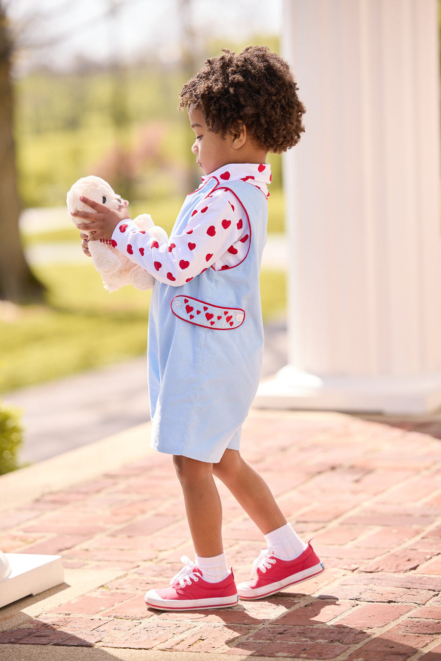 Little English, toddler boy's light blue John John with red piping and embroidered red hearts at the side tabs, printed turtleneck with heart pattern, outfit for Valentines