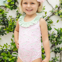 Little English traditional children's clothing. Pink swimsuit with green striped ruffled top and alligator pattern for little girls