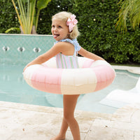 Little English traditional children's clothing. Pink, green, and blue striped swimsuit with blue ruffled top and for little girls