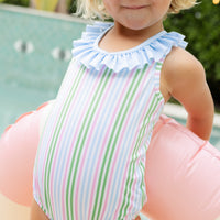 Little English traditional children's clothing. Pink, green, and blue striped swimsuit with blue ruffled top and for little girls