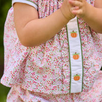 Little English classic children's clothing.  Pink and green floral set for baby girls.  Puff sleeve top with white peter pan collar and placket with pumpkin embroidery paired with matching ruffled bloomer.