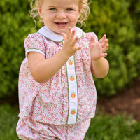 Little English classic children's clothing.  Pink and green floral set for baby girls.  Puff sleeve top with white peter pan collar and placket with pumpkin embroidery paired with matching ruffled bloomer.