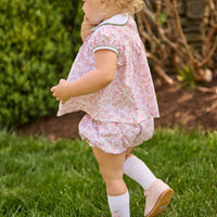 Little English classic children's clothing.  Pink and green floral set for baby girls.  Puff sleeve top with white peter pan collar and placket with pumpkin embroidery paired with matching ruffled bloomer.