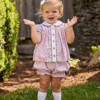 Little English classic children's clothing.  Pink and green floral set for baby girls.  Puff sleeve top with white peter pan collar and placket with pumpkin embroidery paired with matching ruffled bloomer.