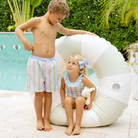 Little English traditional children's clothing. Pink, green, and blue striped swimsuit with blue ruffled top and for little girls