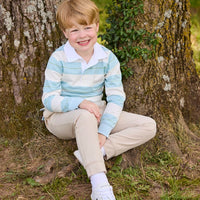 Little English traditional children's clothing.  Cream, aqua and green rugby polo paired with tapered khaki sport pant for little boys.