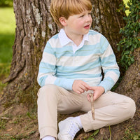 Little English traditional children's clothing.  Cream, aqua and green rugby polo paired with tapered khaki sport pant for little boys.