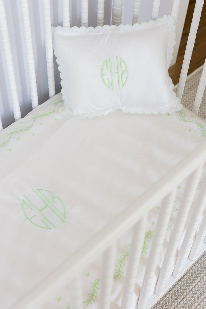 Little English traditional children's clothing.  Scallop pillow case and embroidered crib sheet in meadow green embroidery 