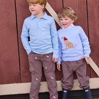 Little English traditional children's clothing.  Classic long sleeve light blue polo and chocolate brown corduroy pants with seated lab embroidery for boys.  Light blue crew neck intarsia sweater with seated lab motif layered over lab printed turtleneck and paired with chocolate brown corduroy banded pants.