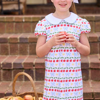 Little English classic children's clothing.  Short sleeve white knit peter pan dress with school themed print.  Back to school outfit for little girls.