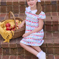 Little English classic children's clothing.  Short sleeve white knit peter pan dress with school themed print.  Back to school outfit for little girls.