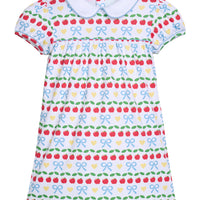 Little English traditional children's clothing.  Short sleeve white knit peter pan dress with back to school print for little girls