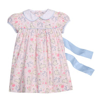 Little English traditional children's clothing.  Classic peter pan dress with capped sleeves and a light blue sash in a light pink bunny print for little girls.  Easter outfit for girls.