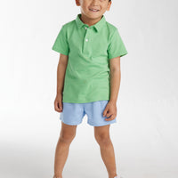 Little English classic clothing for kids, little boy's elastic waist short in light blue twill, pull on short for spring with green solid short sleeve polo