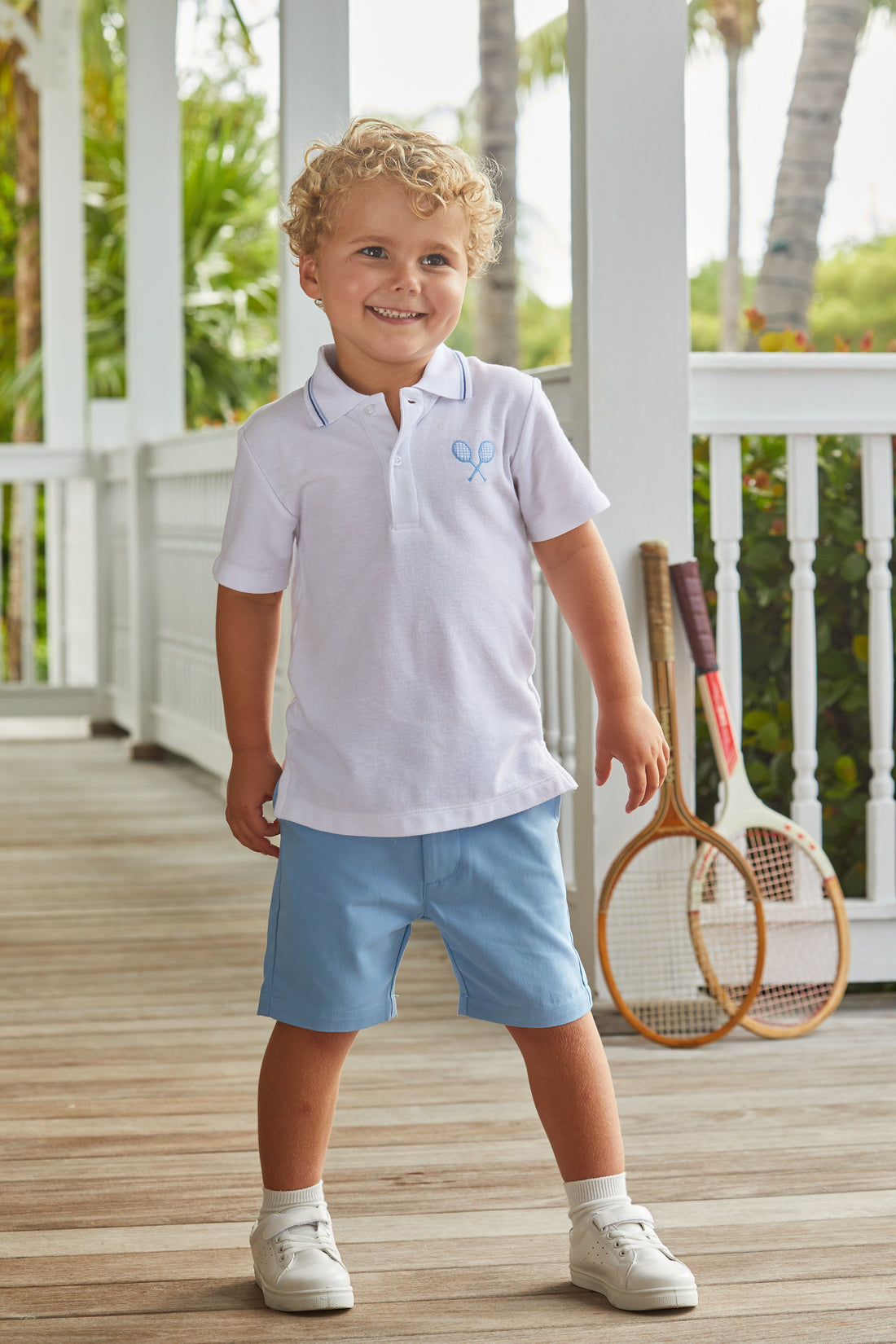 Little English classic boys clothing, white short sleeve polo with tipping at the collar and crossed tennis racket embroidery