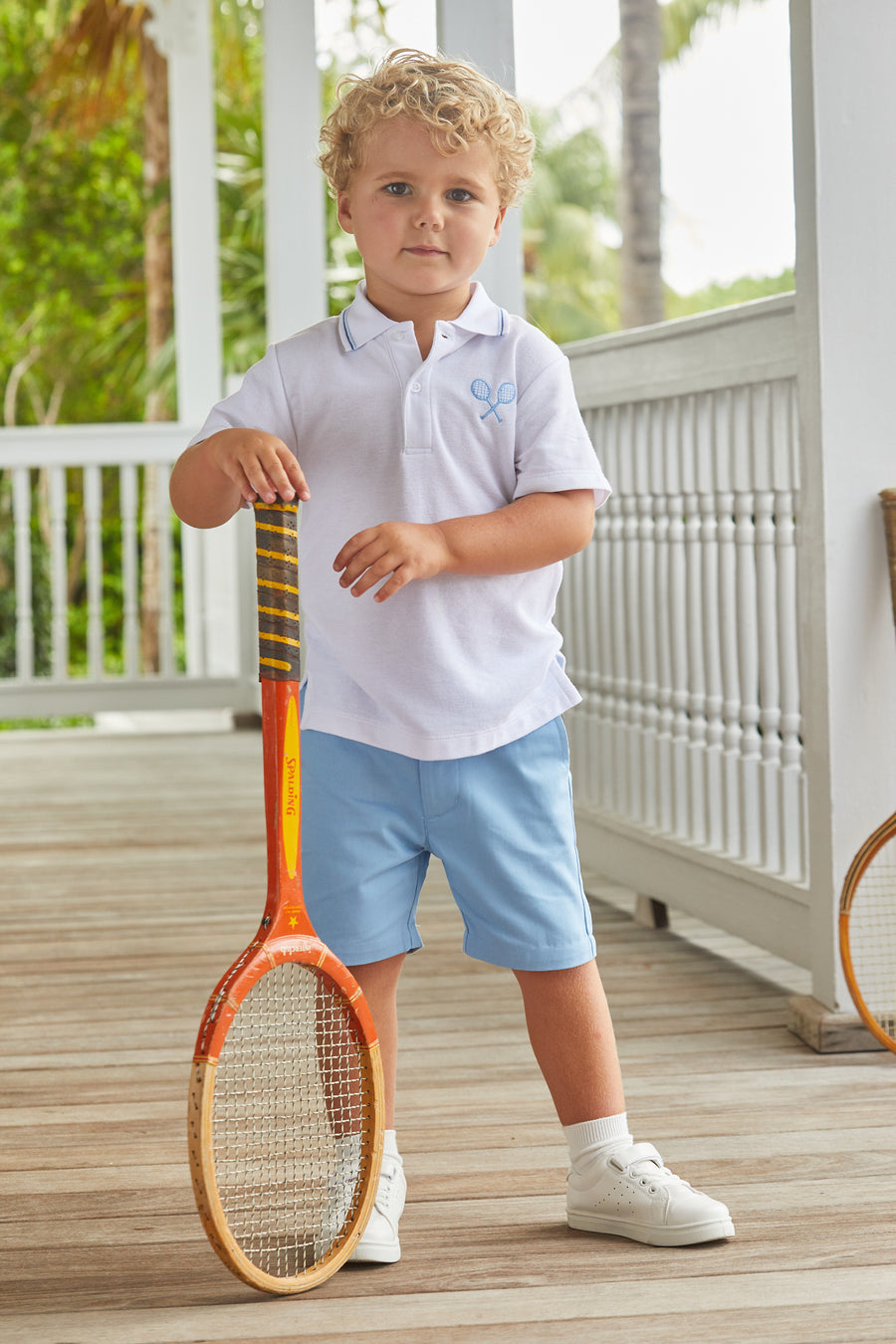Little English classic boys clothing, white short sleeve polo with tipping at the collar and crossed tennis racket embroidery