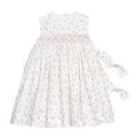 Little English traditional children's clothing.  White sleeveless smocked dress with pink and green florals for little girls