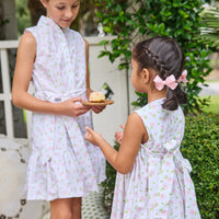Little English traditional children's clothing.  White sleeveless smocked dress with pink and green florals for little girls