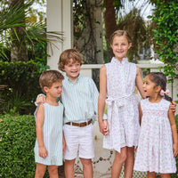 Little English traditional children's clothing.  White sleeveless smocked dress with pink and green florals for little girls