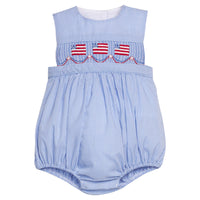 Little English traditional children's clothing.  Sleeveless bubble in royal blue mini check fabric and smocking at the chest with American flag bunting for baby boys