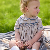 Little English classic children's clothing.  Smocked peter pan bubble in tan and blue Durham windowpane with blue piping for baby boys