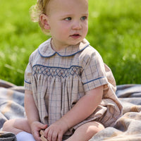 Little English classic children's clothing.  Smocked peter pan bubble in tan and blue Durham windowpane with blue piping for baby boys