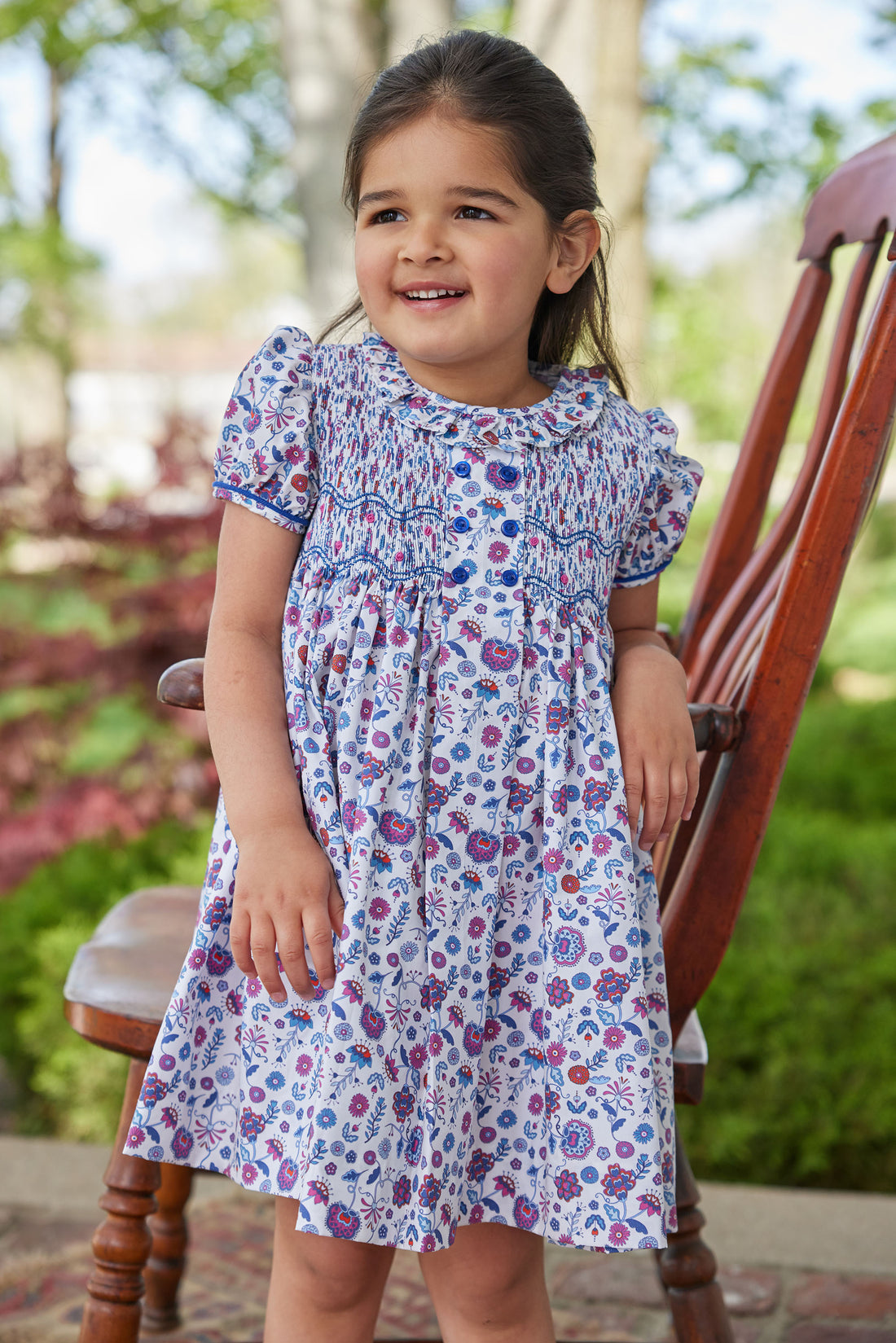 little english classic childrens clothing girls purple blue and red floral dress with smocking at chest and ruffled collar