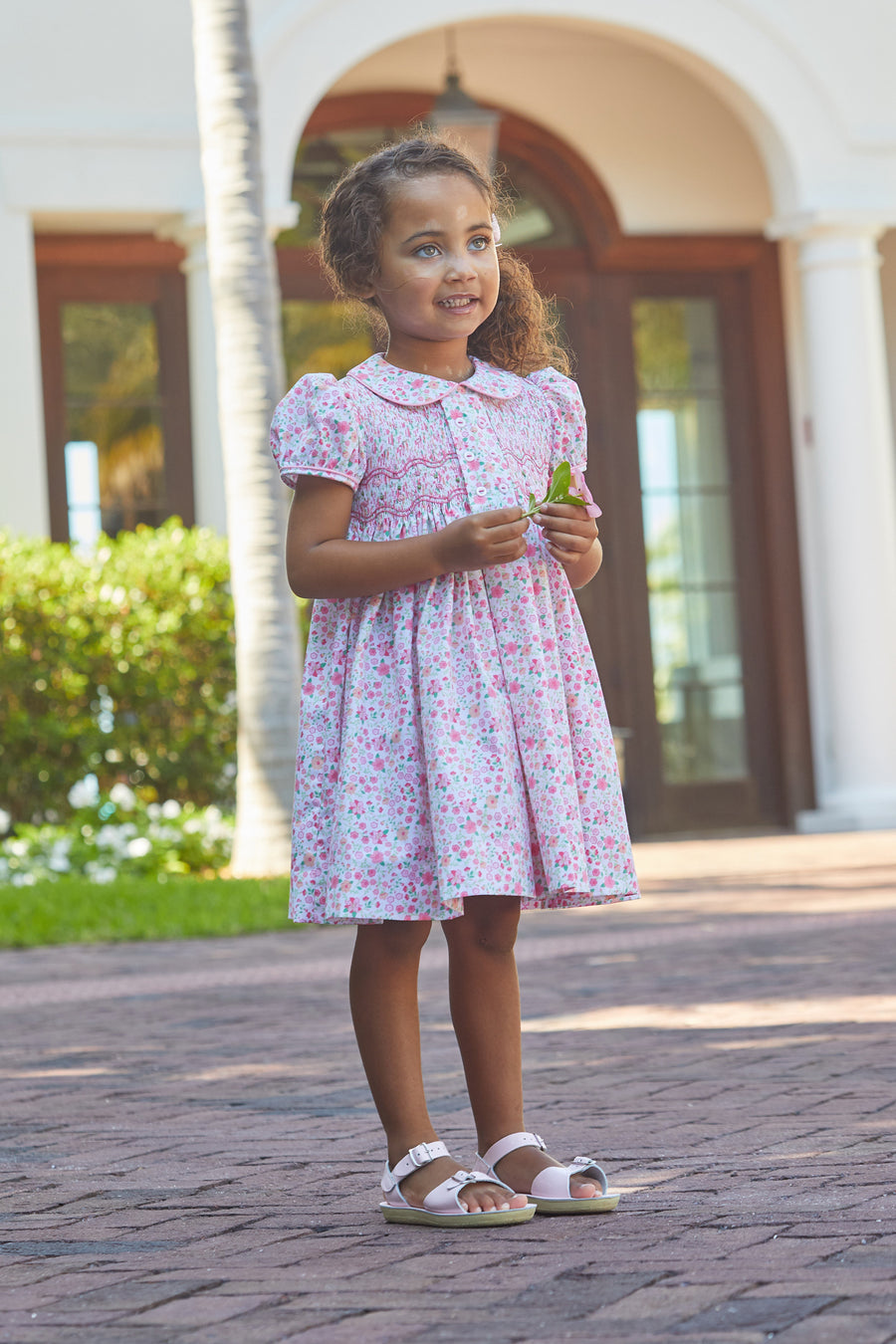 Little English traditional children's clothing, girl's classic light pink floral smocked dress for Spring with puff sleeves and peter pan collar