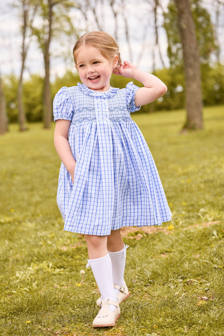 Little English classic smocked dress for little girls. Blue and white plaid dress with ruffled collar  and smocking across the chest for Fall