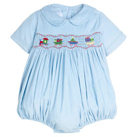Little English traditional children's clothing. Short sleeve peter pan bubble in light blue corduroy with holiday train smocking across the chest for baby boys