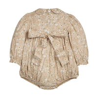 Little English traditional children's clothing. Long sleeve peter pa bubble in tan and white Camden floral with smocking at the chest for baby girls