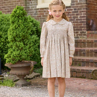 Little English traditional children's clothing. Long sleeve peter pan dress in tan Camden Floral with smocking across the chest for little girls.