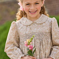 Little English traditional children's clothing. Long sleeve peter pan dress in tan Camden Floral with smocking across the chest for little girls.