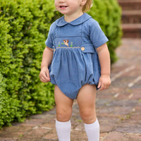 Little English classic children's clothing.  Baby boys stormy blue corduroy peter pan bubble with button tabs and flying mallard smocking across the chest.