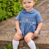 Little English classic children's clothing.  Baby boys stormy blue corduroy peter pan bubble with button tabs and flying mallard smocking across the chest.
