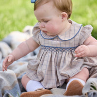 Little English classic children's clothing.  Smocked peter pan bubble in tan and blue Durham windowpane with puff sleeves and blue piping for baby girls
