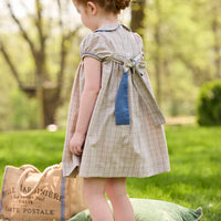 Little English traditional children's clothing.  Smocked peter pan dress in tan and blue Durham Windowpane with capped sleeves for toddler girls