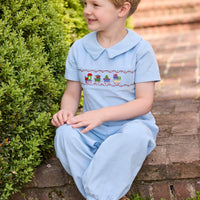 Little English traditional children's clothing. Boys blue corduroy set - banded pants paired with Eaton collar short sleeve top with holiday train smocking across the chest.