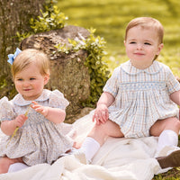 little english classic children's clothing baby light blue, cream, and light tan floral bubble for girl and plaid for boy with peter pan collar, chest smocking, and embroidery, for fall 