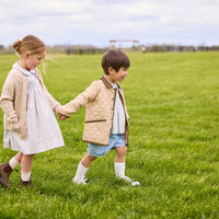 Little english classic childrens clothing, short set for boys in light blue and brown winthrop plaid with light blue corduroy shorts, Classic quilted jacket in khaki, Peter pan dress in winthrop floral print with smocking on chest, cashmere blend sweater in oatmeal, coordinating sibling outfits for fall 