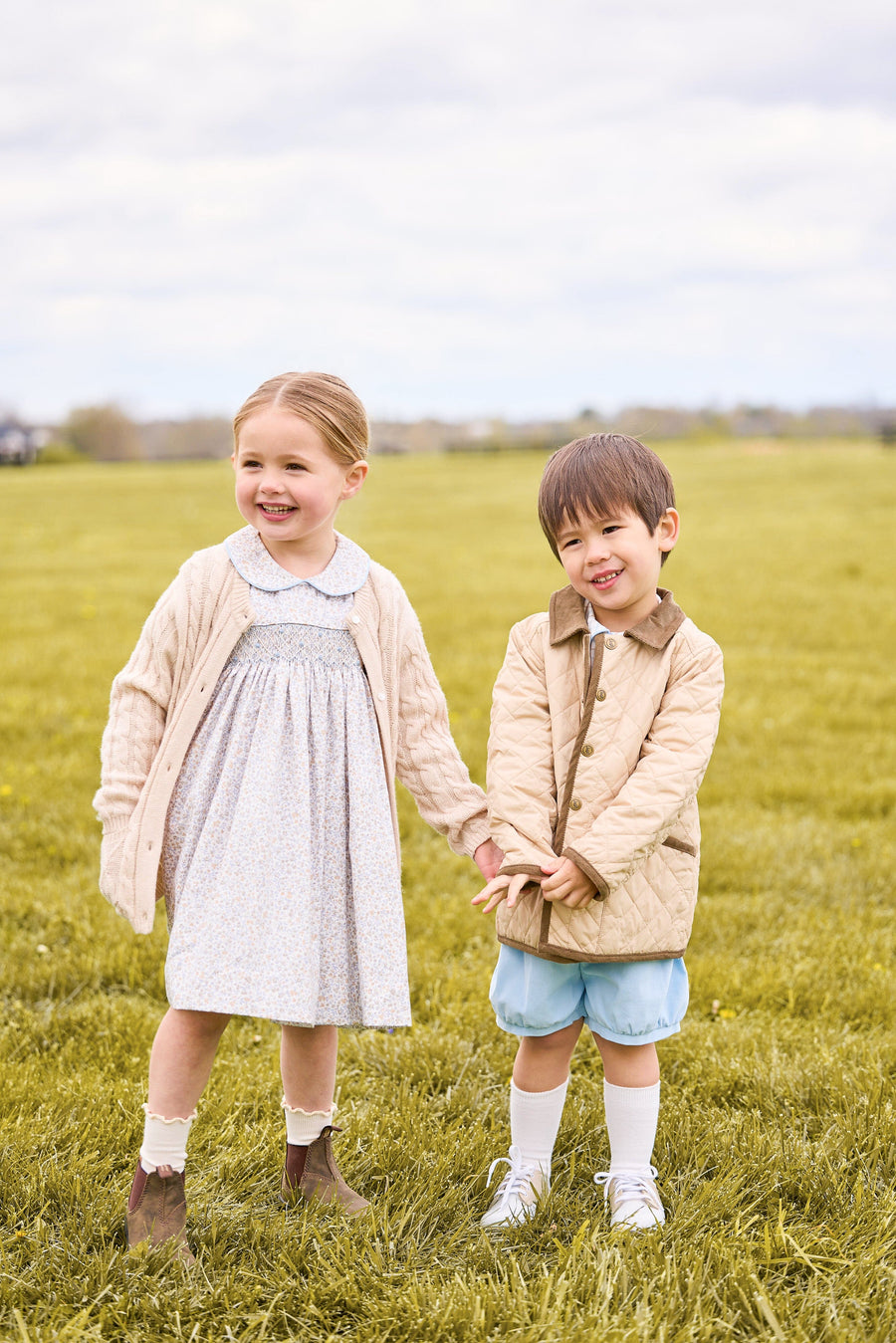 Little english classic childrens clothing, short set for boys in light blue and brown winthrop plaid with light blue corduroy shorts, Classic quilted jacket in khaki, Peter pan dress in winthrop floral print with smocking on chest, cashmere blend sweater in oatmeal, coordinating sibling outfits for fall 