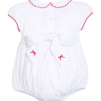 Little English traditional children's clothing.  Puff sleeve white peter pan bubble with scalloped collar, red trim, and bow smocking across the chest.  Dressy outfit for baby girls for the holiday