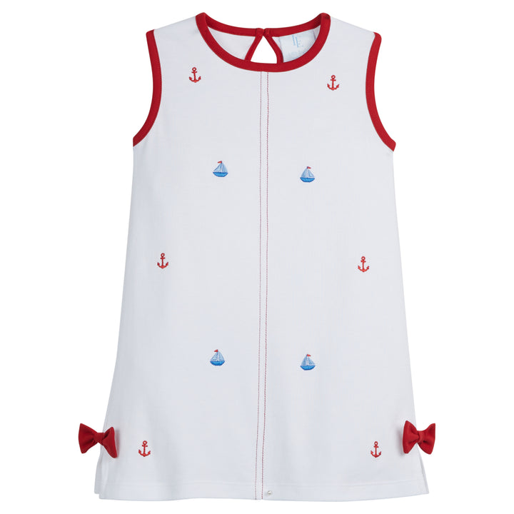 Little English traditional children's clothing, girl's sleeveless white knit dress for Summer, with embroidered sailboats and anchors and red bow detail 