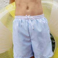 Little English traditional children's clothing. Blue swim trunks for little boys for summer