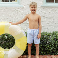 Little English traditional children's clothing. Blue swim trunks for little boys for summer