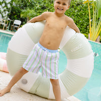 Little English traditional children's clothing. Blue, pink, and green striped swim trunks for little boys for summer