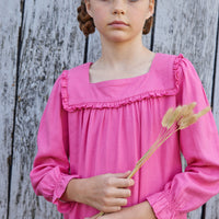Little English classic childrens clothing tween girls bright pink long sleeve dress with ruffle detail on skirt and neckline