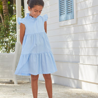 Little English traditional children’s clothing, girl's light blue tiered dress for Spring with ruffles at the collar and sleeves