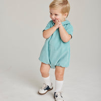 Little English baby boy classic canton corduroy woven bubble with clear buttons on both sides of front 